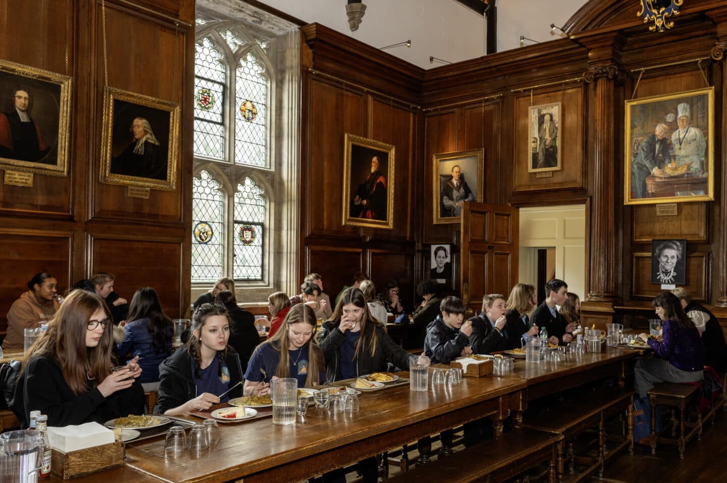 Pathfinders students eating at long tables in Dining Hall