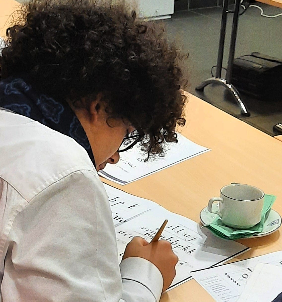 Pathfinders student writing at a desk