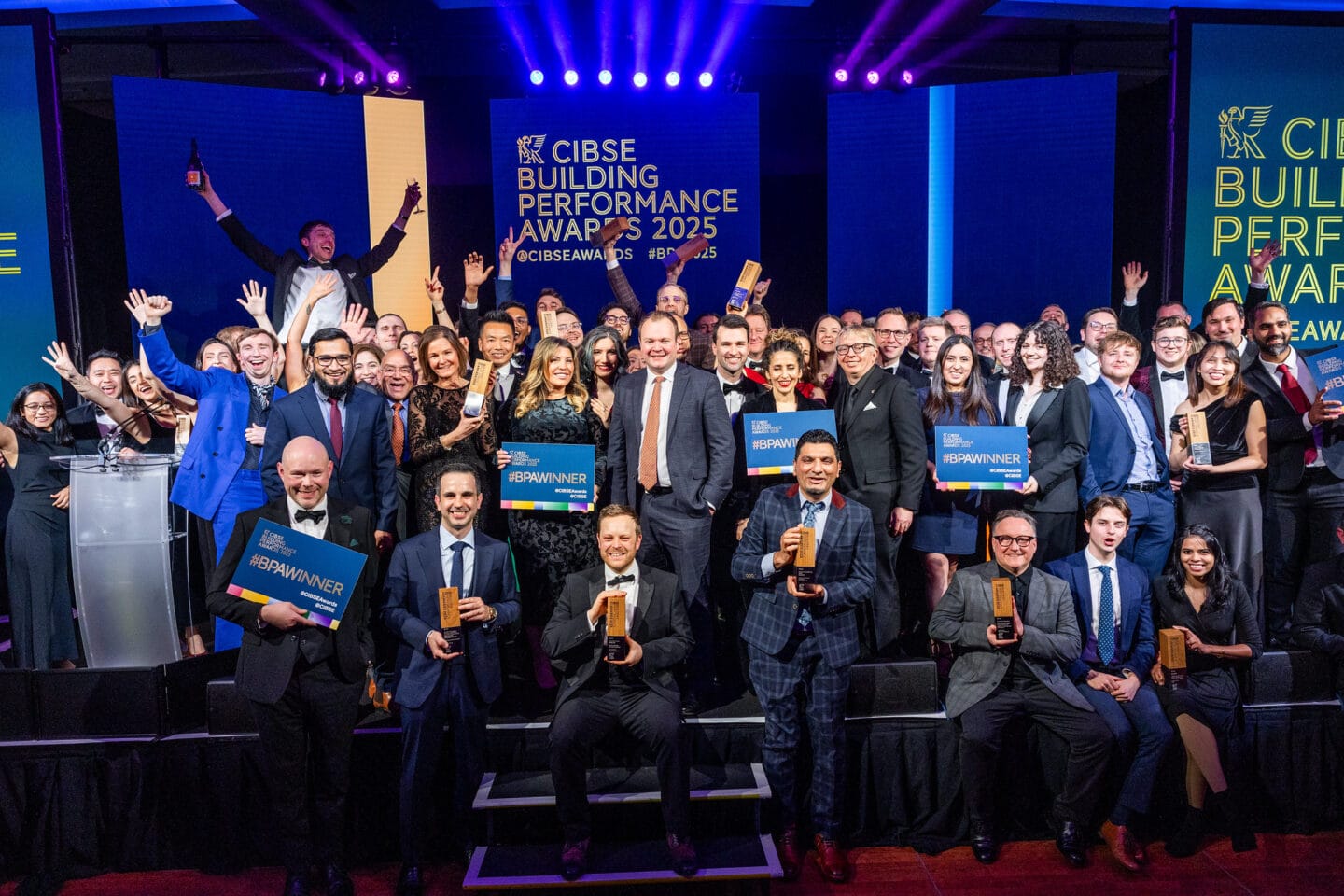 CIBSE Award ceremony showing all winners on stage holding their trophies