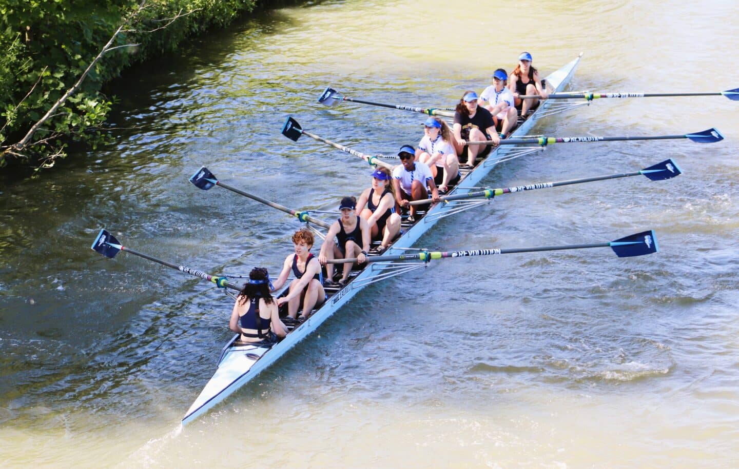 Photo of women's crew rowing on the river