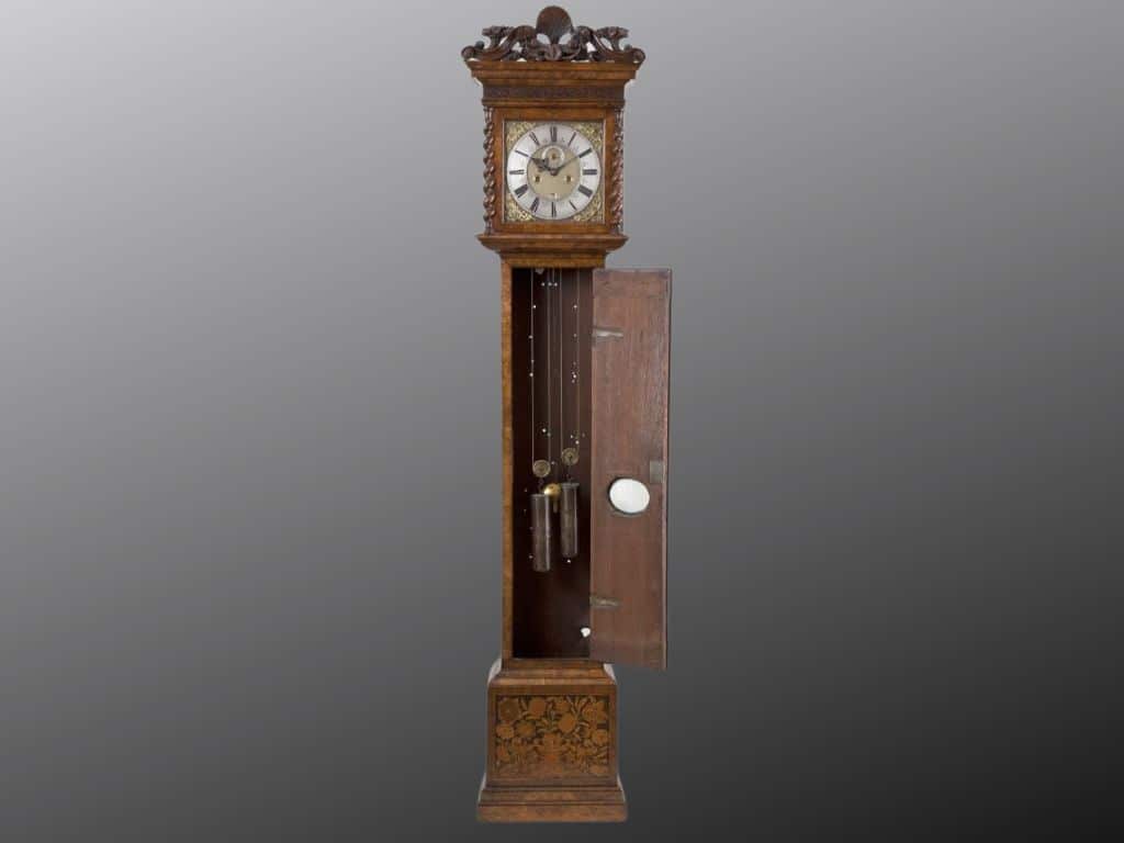 Photo of the front of the Daniel Quare clock with the casement door open revealing the internal mechanism