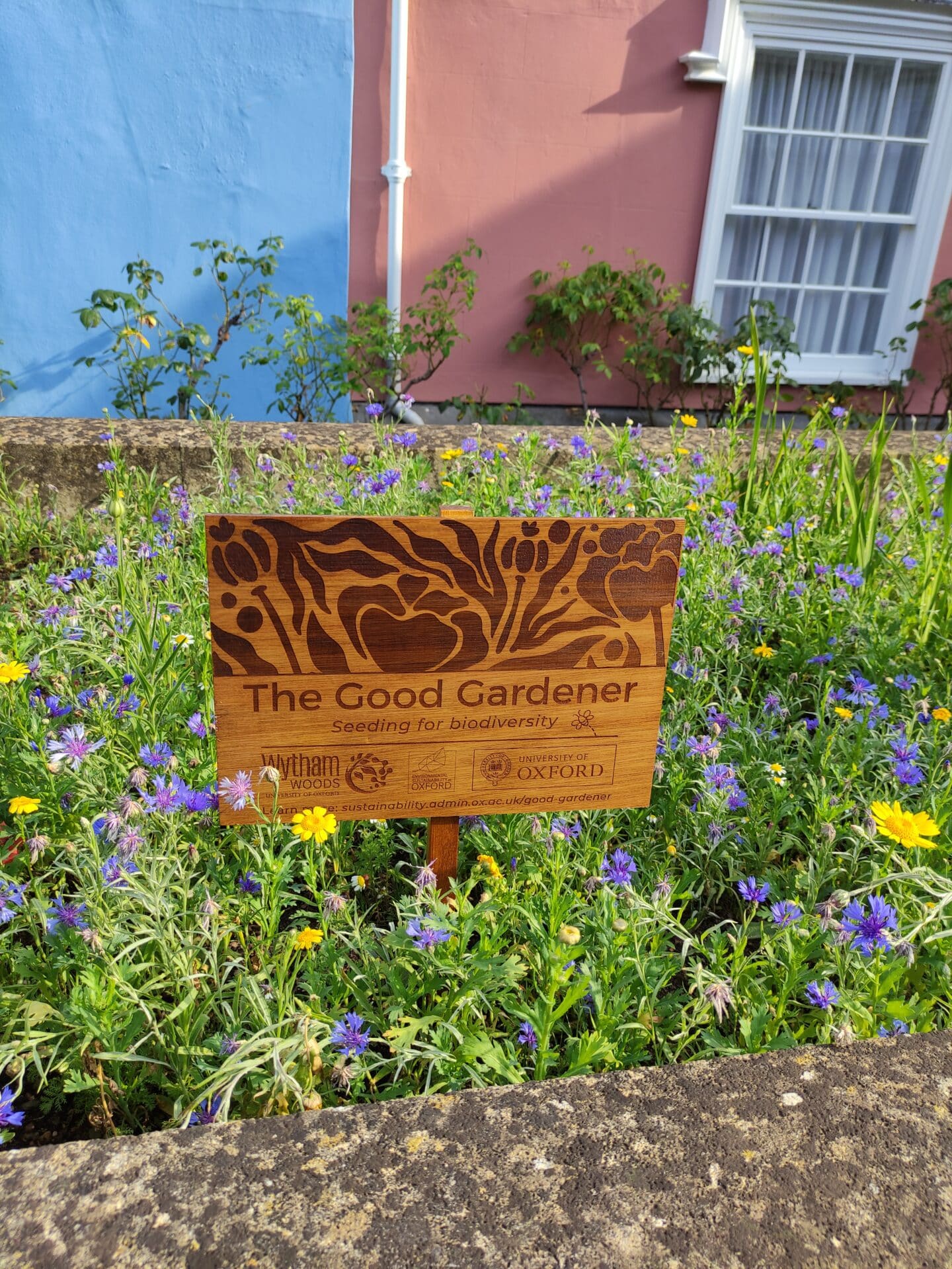Photo of Good Gardener sign in the wildflower garden