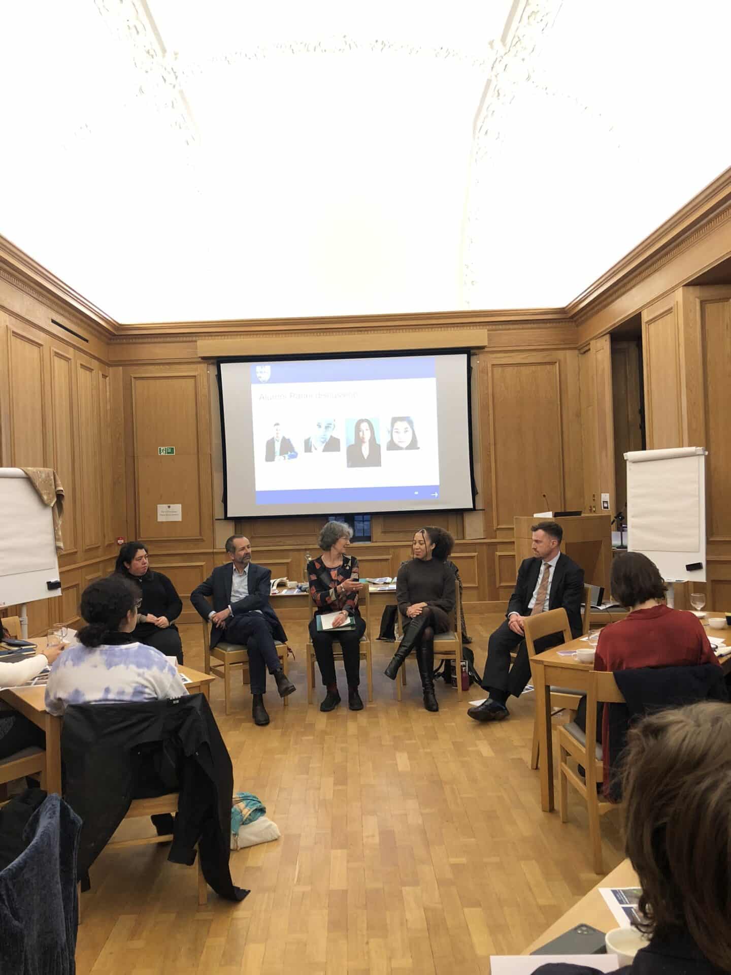 Five panellists in duscussion in front of audience of Hartley students
