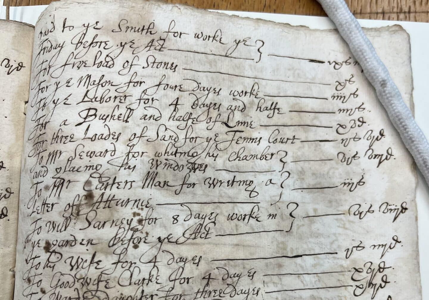 1617 College account record detailing purchase of three loads of sand for the tennis court at 3 shillings and 7 pence. The entry appears in an aged manuscript with Tudor-era handwriting.