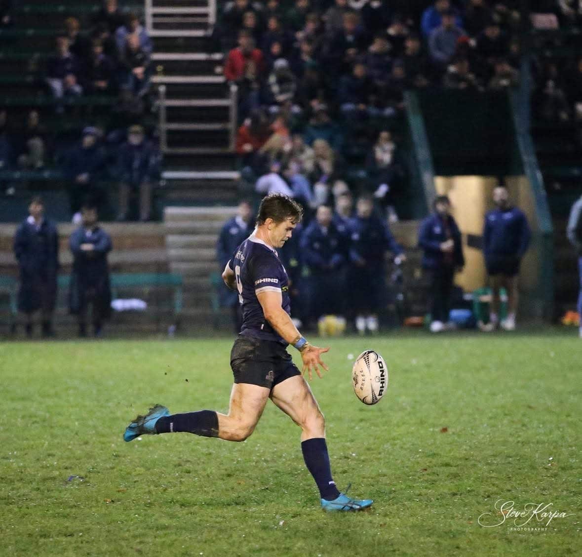 Jack Hamilton running to catch the ball before it hits the grass