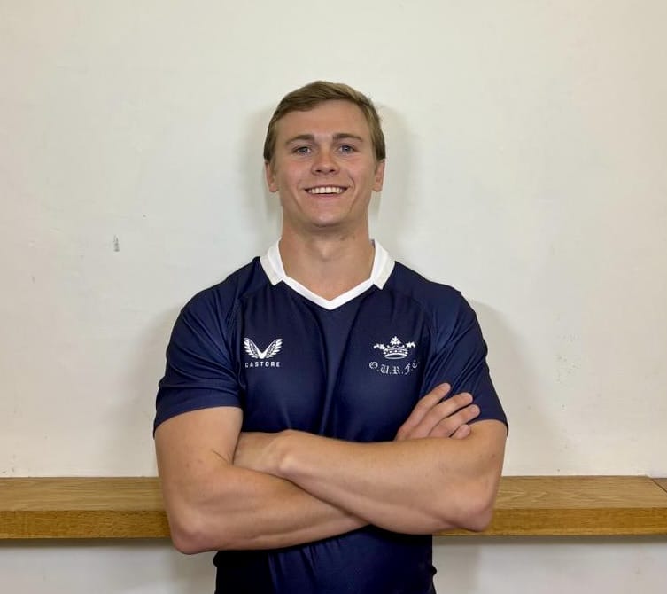 Photo of Jack Hamilton with arms crossed wearing Blues jersey