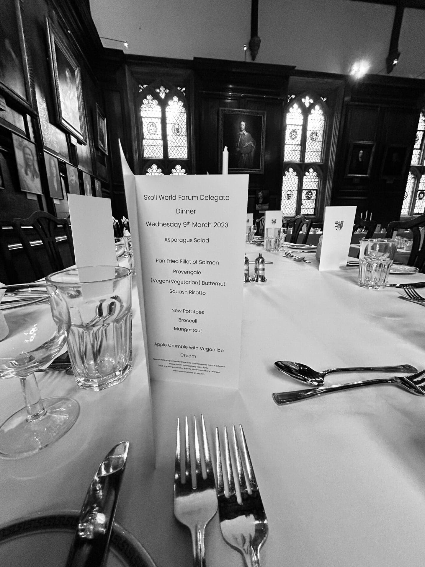 Black and white picture of Hall, focusing on a menu for the Skoll World Forum Delegate Dinner