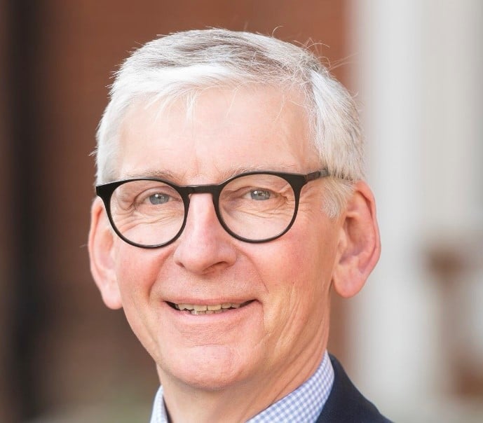 Photo of Nigel Clifford in blue and white checked shirt and blue jacket