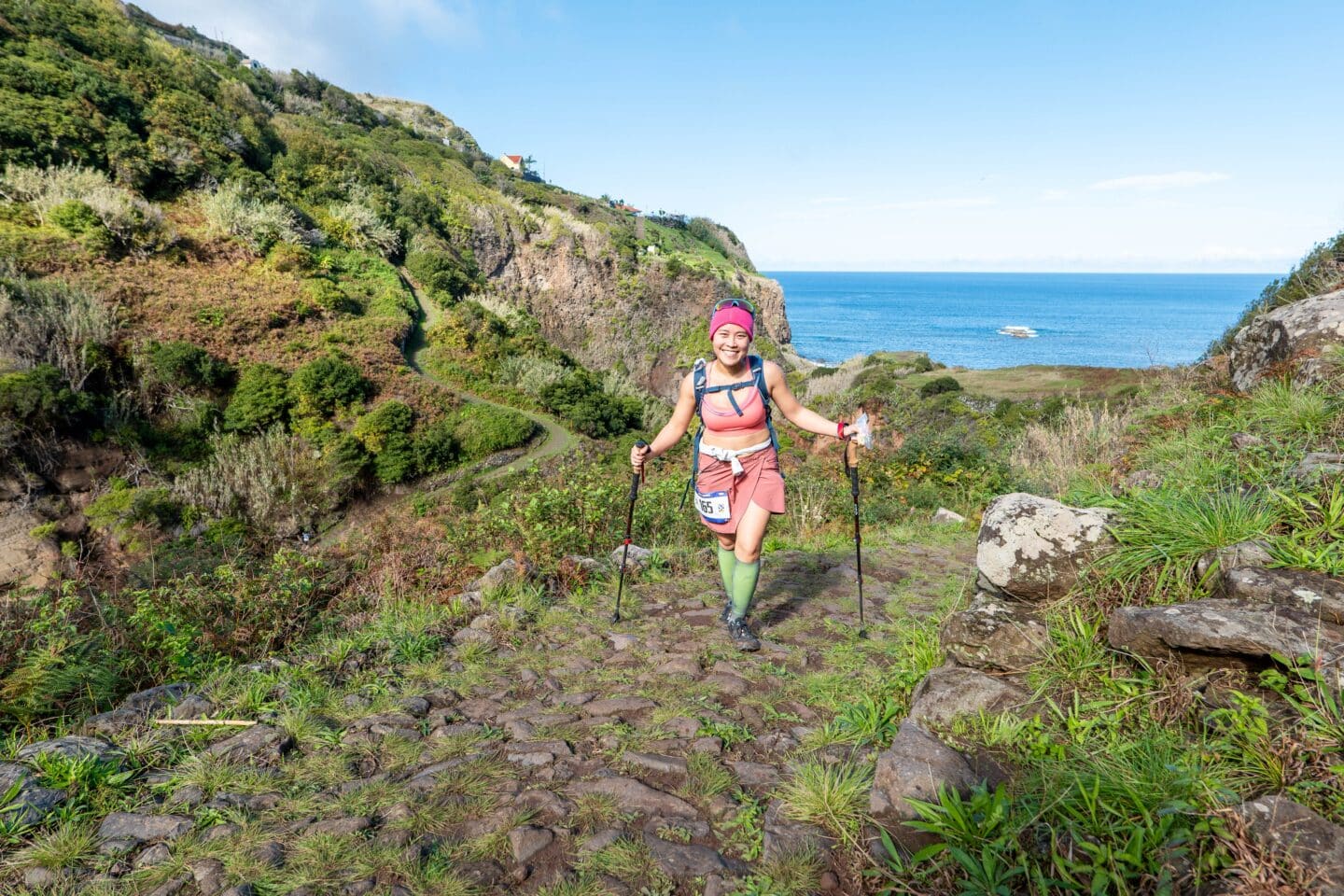 Micon Garvilles, running ultramarathon on a stony path with the ocean in the background