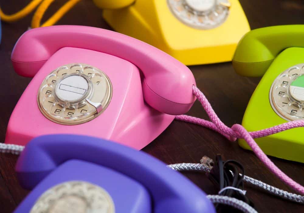Colourful, old fashioned telephones