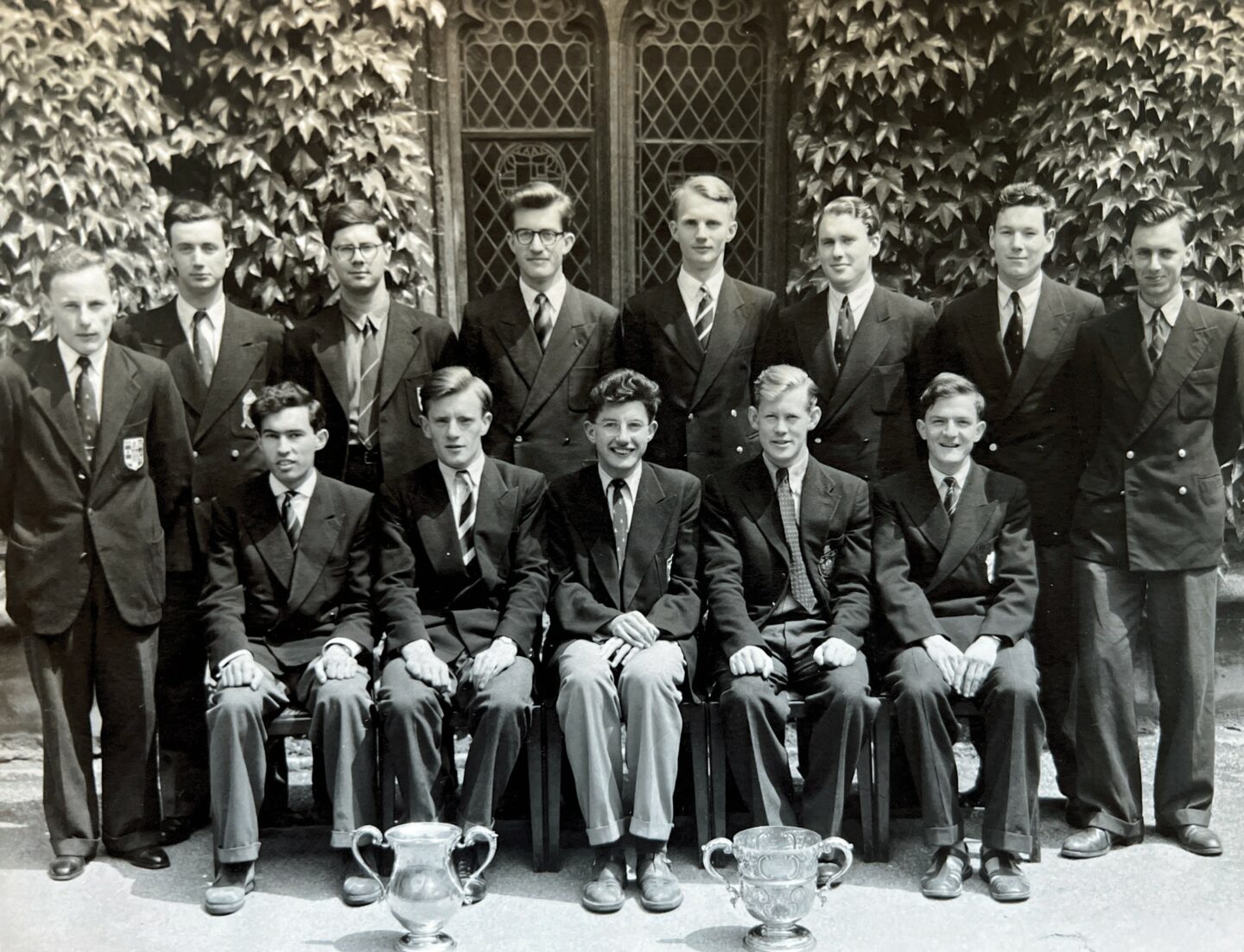 Posed black and white photo of the Lincoln cross country team in 1954