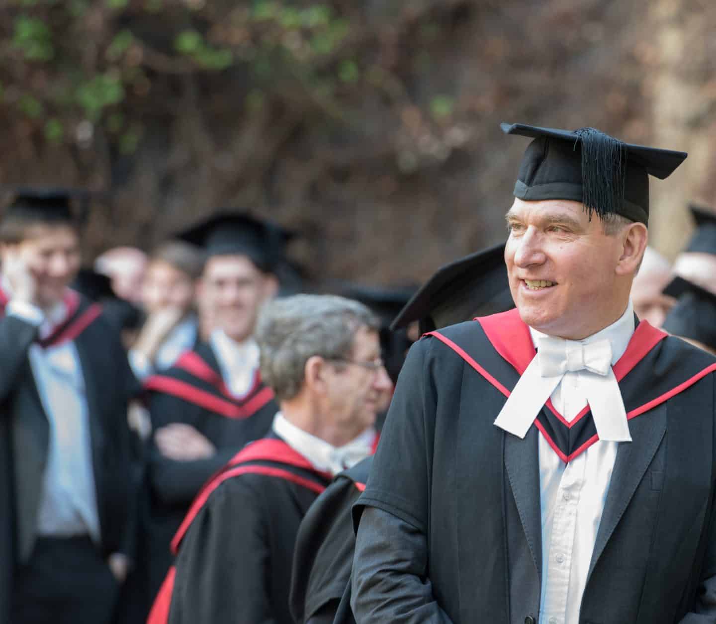 The Rector in his gown and cap