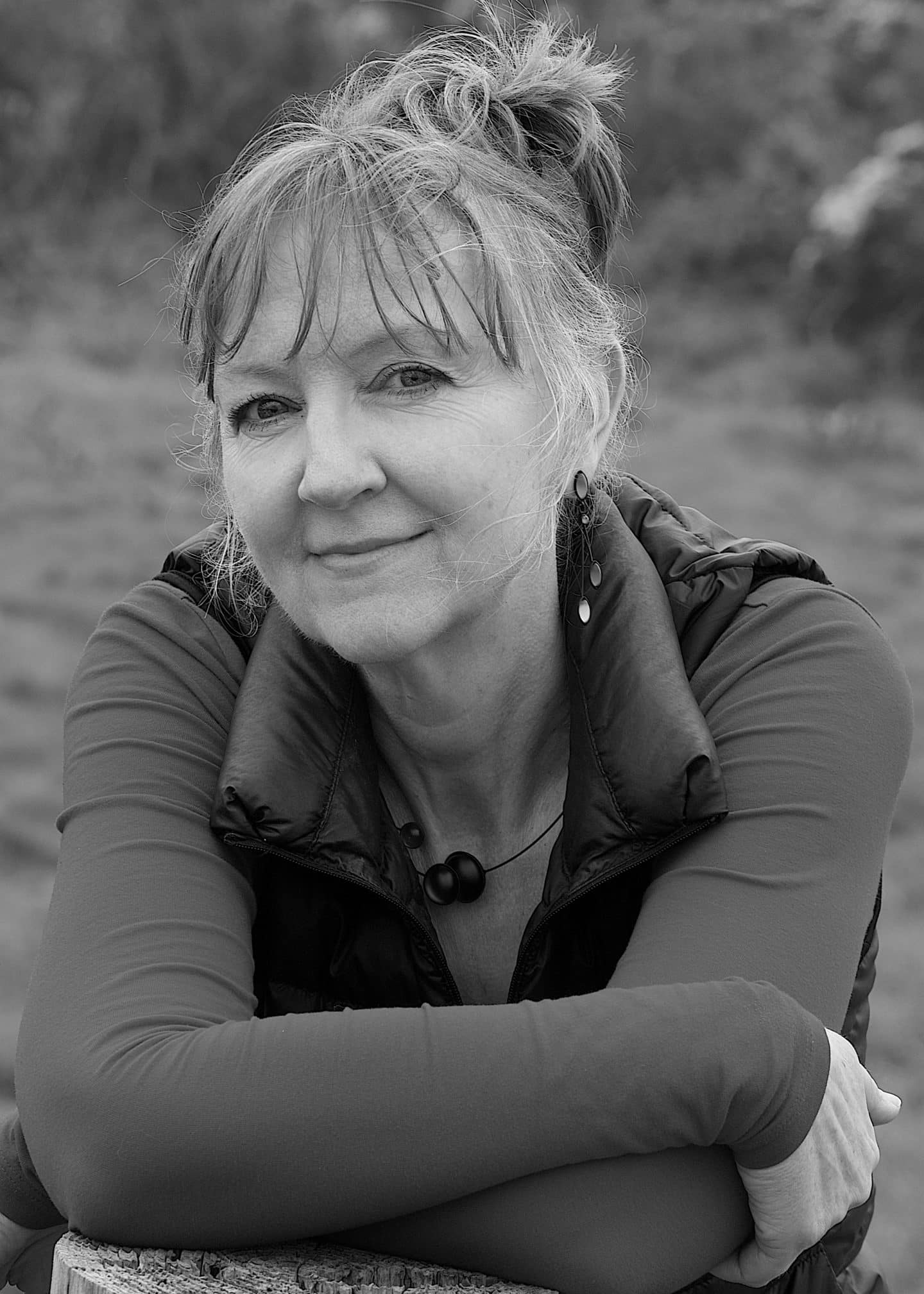 Greyscale photograph of Fiona McPhee, a woman in a jacket