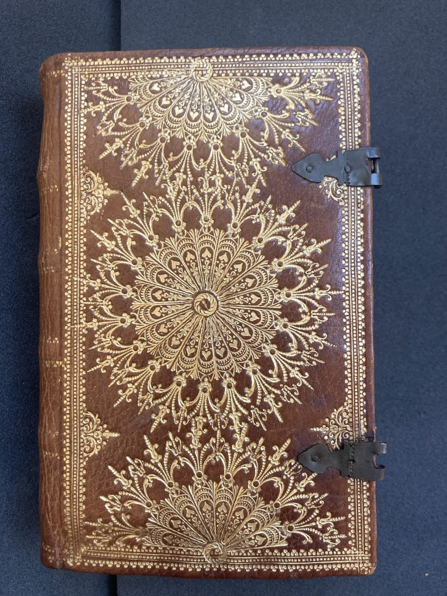Gilded cover of an Armenian Bible, elegant brown leather with golden decorative patterns