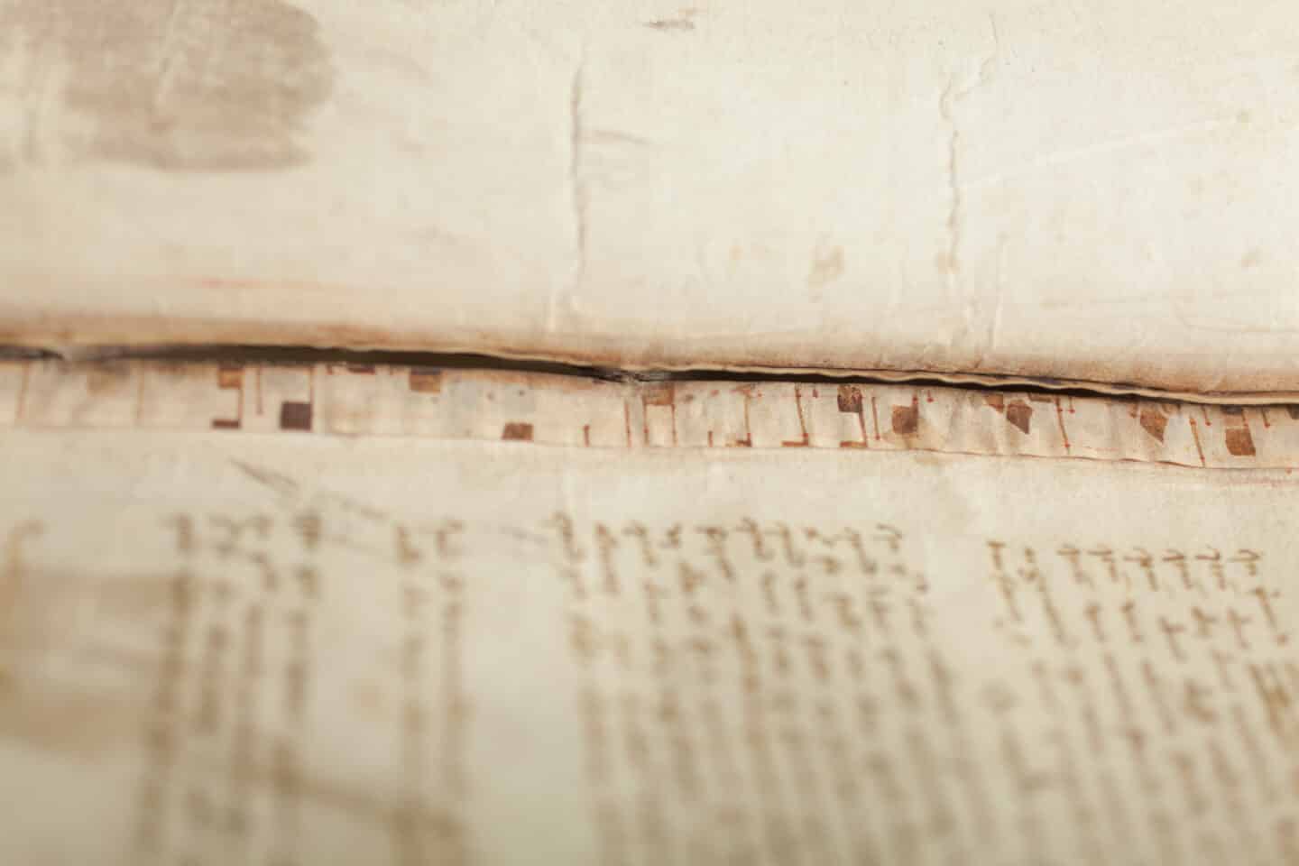 Image of musical notation at the side of an old page