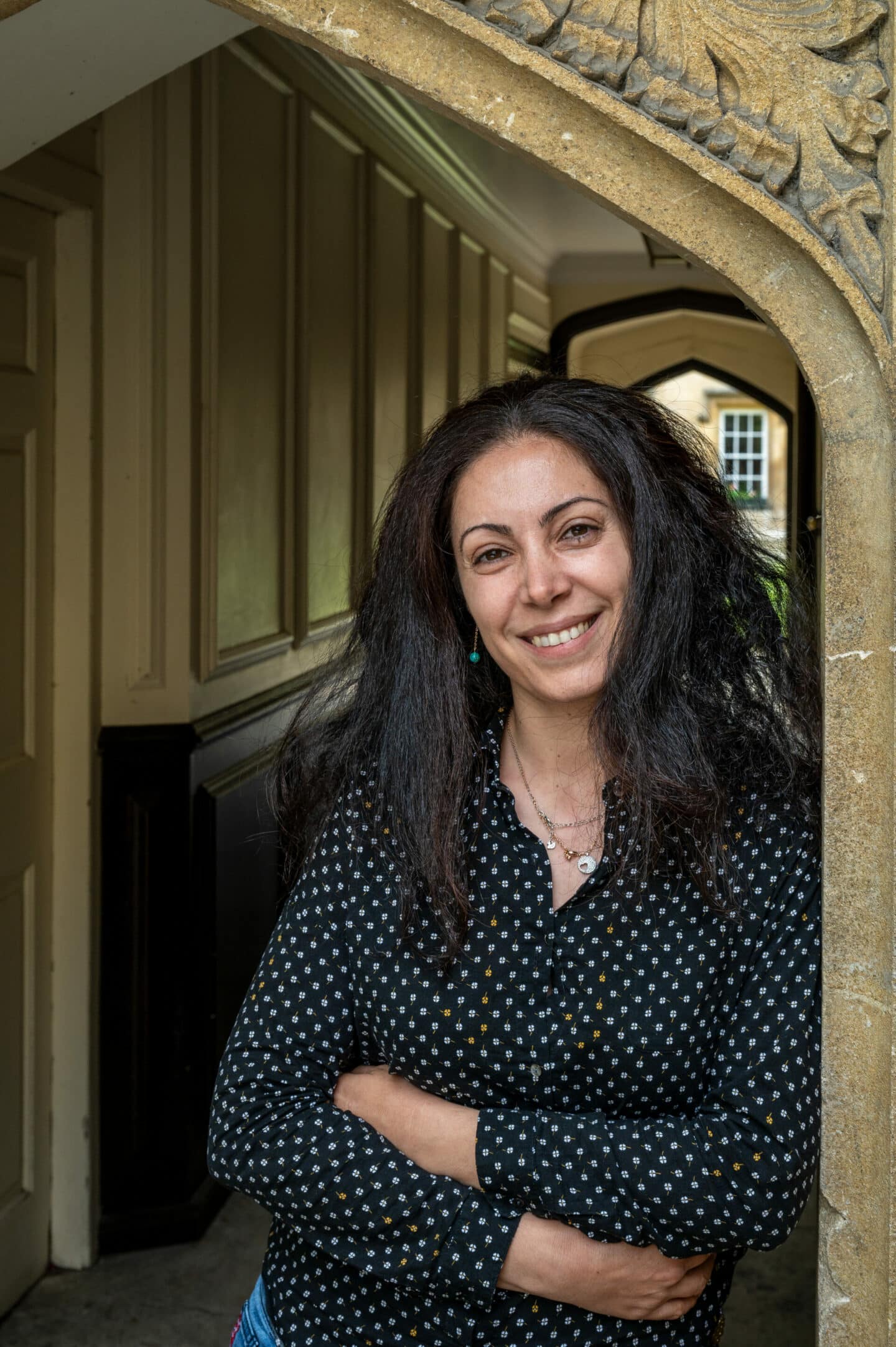 Photograph of Nancy Zaarour in a passageway in Lincoln College