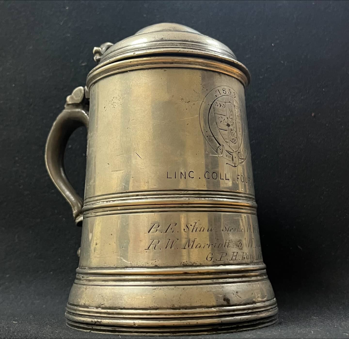 Photo of silver LCBC tankard with Lincoln logo and names enscribed