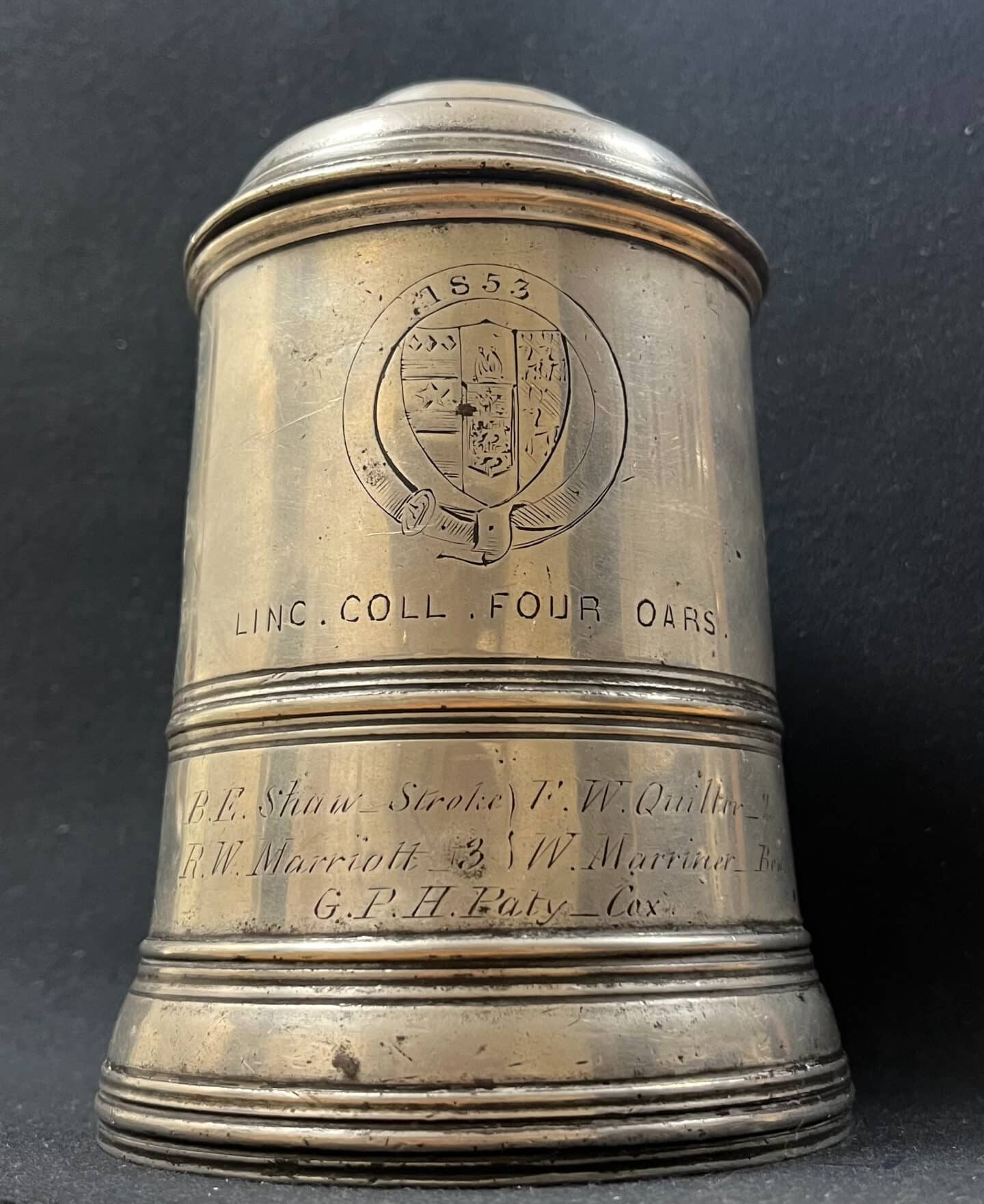 Photo of silver LCBC tankard with Lincoln logo and names enscribed