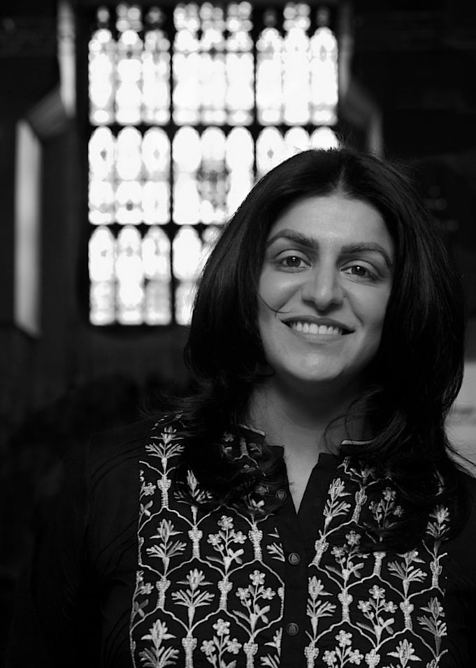 Greyscale photograph of Shabana Mahmood, a woman in a patterned top