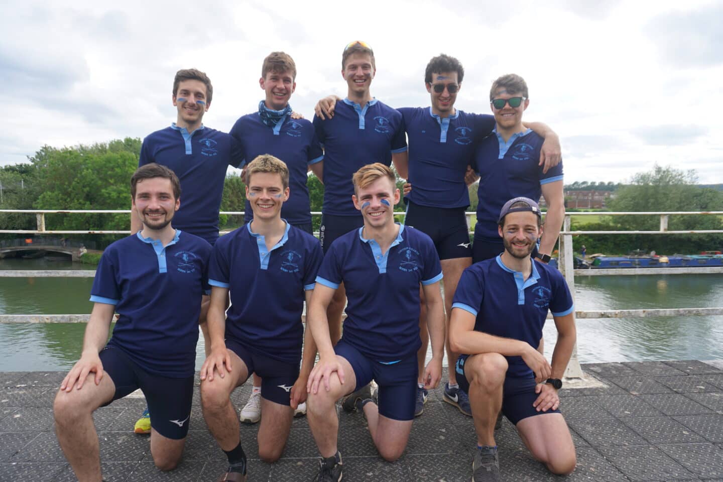 The M1 crew, all dressed in blue.