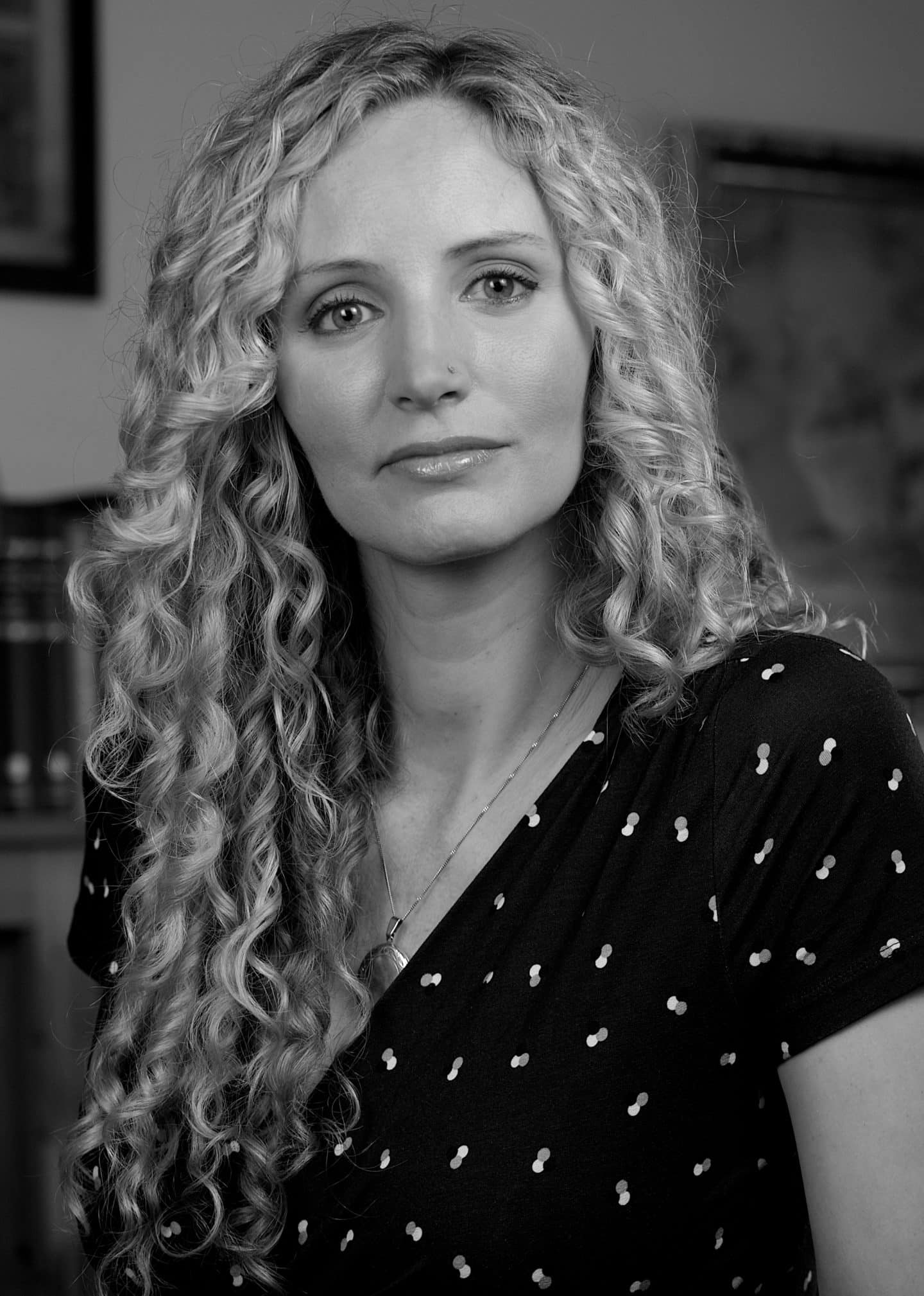 Greyscale photograph of Suzannah Lipscomb, a woman in a black top and necklace